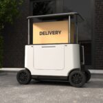 An autonomous delivery robot van with a parcel.